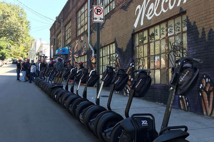 A tour group headed into an art gallery.