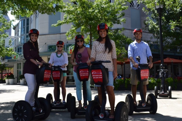 A group posing for a picture while on Midtown tour
