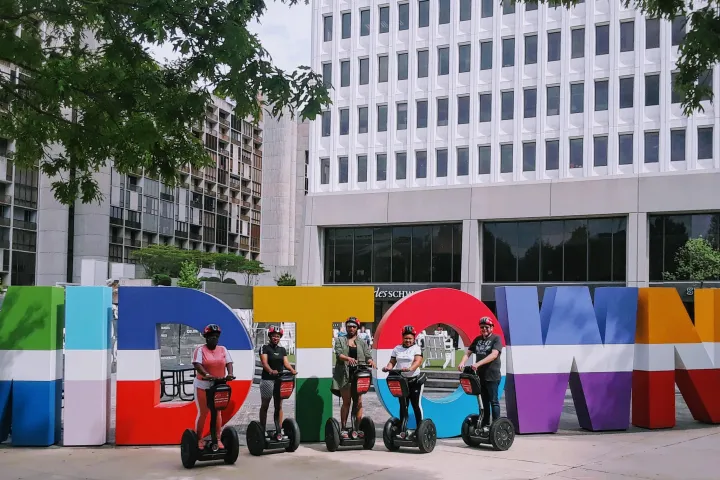 a group of people standing in front of a building