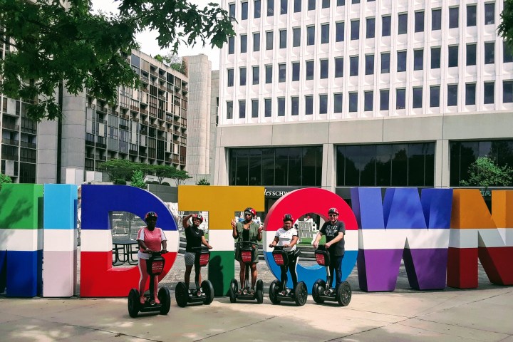 a group of people standing in front of a building
