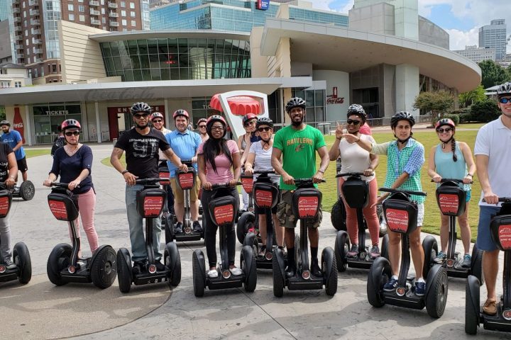 a group of people standing in a parking lot