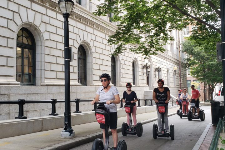 a group of people on a sidewalk