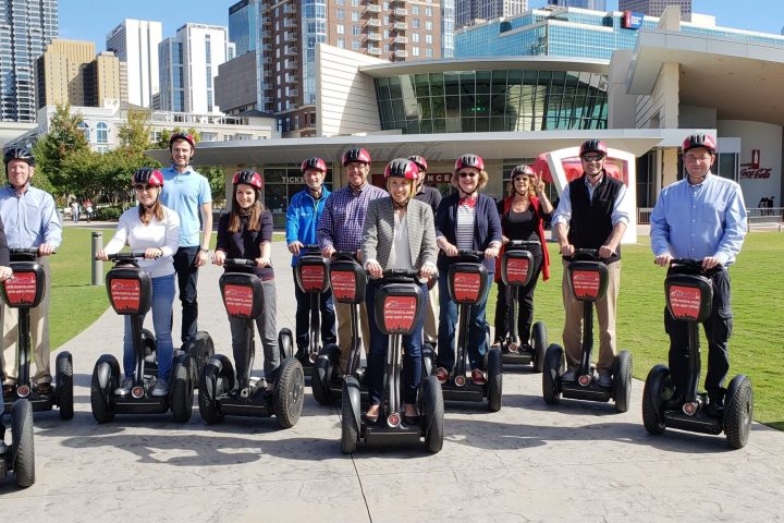 a group of people standing in front of a building