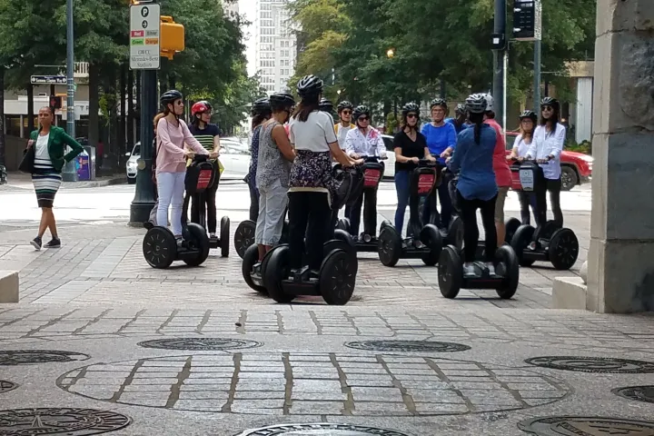 a group of people on a sidewalk
