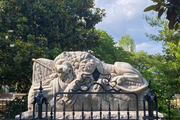 a statue of a sleeping lion in atlanta