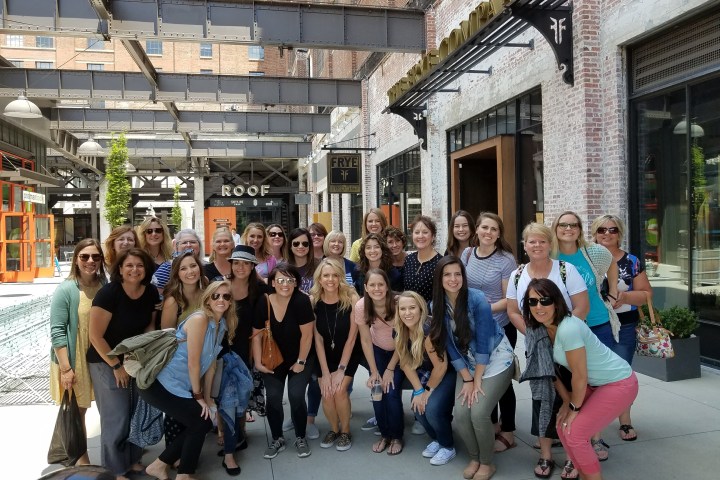 Katie Ellis et al. standing in front of a building