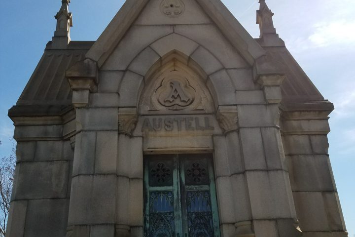 a statue in front of a building