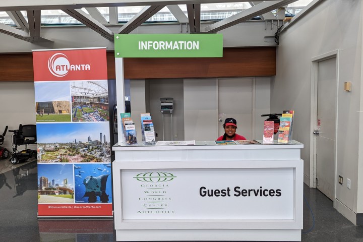 Information desk with brochures at Atlanta's Georgia World Congress Center guest services.