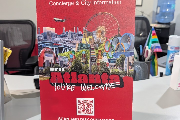 A brochure titled 'Discover Atlanta' with city images and a QR code.